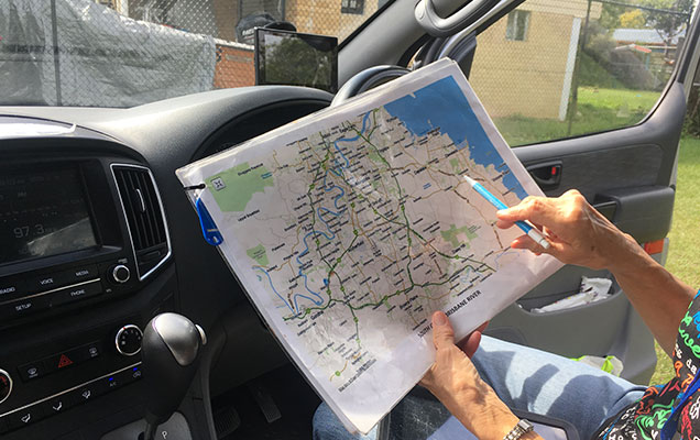 RSPCA animal ambulance driver reading road map